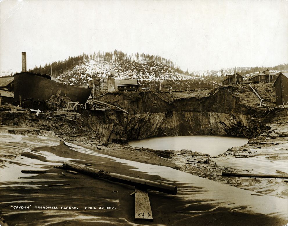 The Treadwell mines and company town came to a spectacular end on April 21, 1917, when a massive cave-in flooded three of four underground mines, 2,300 feet deep. They’d yielded 10 million tons of ore. The void was filled with an estimated 3 million tons of seawater. Failure of unstable underground rock pillars and an extreme high tide led to the collapse. (Alaska State Library / Harry F. Snyder Photograph Collection P38-100)