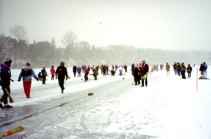 A group of people walking in the snow    Description automatically generated