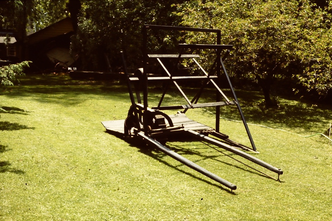 THE RESTORED MCCORMICK REAPER IN OUR BACK YARD BEFORE BEING SENT TO NORTHERN IRELAND